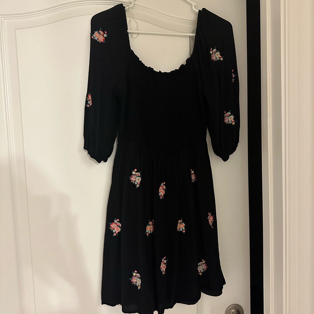 Black dress perfect for spring. Can wear off the shoulders